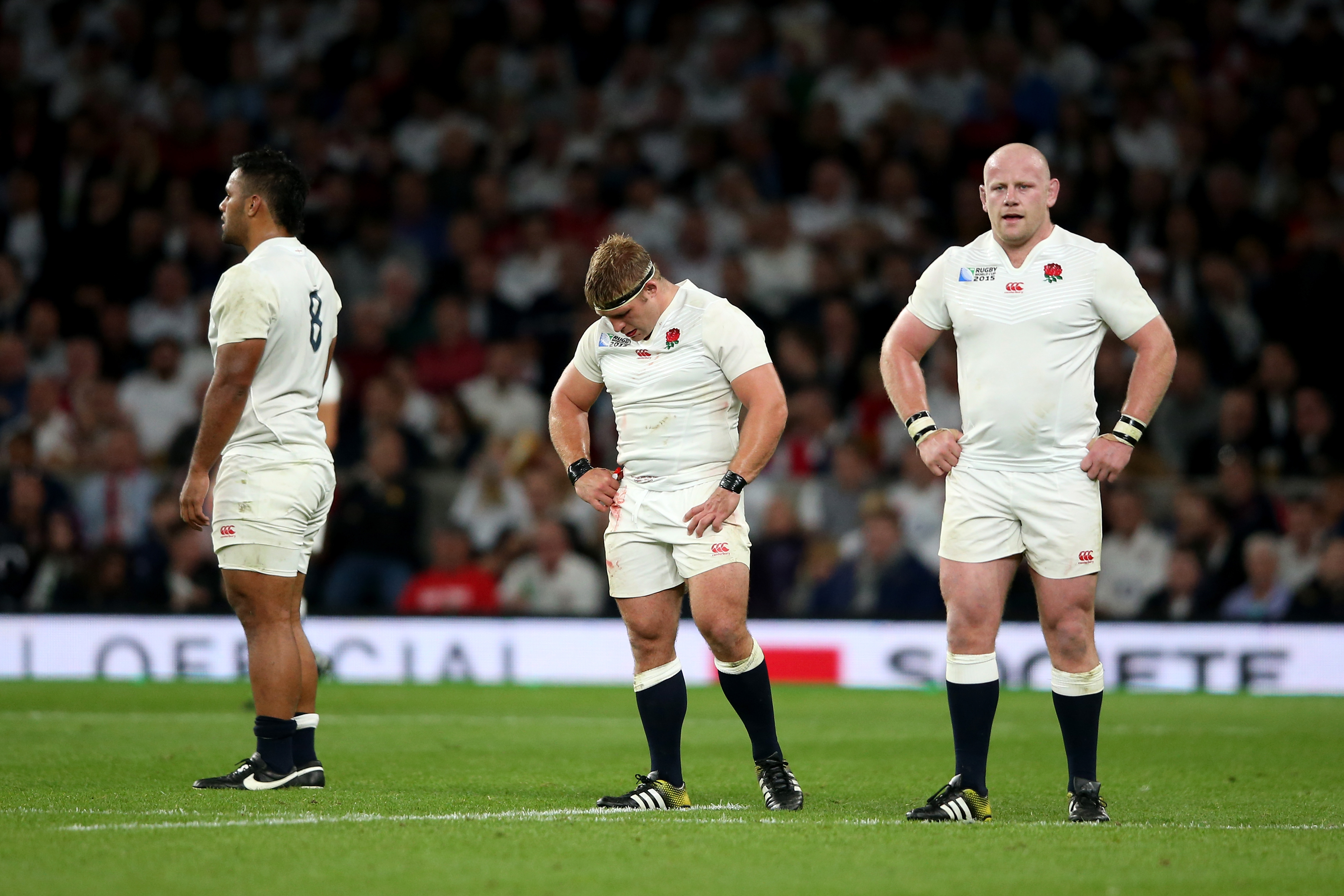 LONDON, ENGLAND - SEPTEMBER 26: (L-R) Billy Vunipola, Tom Youngs and Dan Cole of England look dejected during the 2015 Rugby World Cup Pool A match between England and Wales at Twickenham Stadium on September 26, 2015 in London, United Kingdom. (Photo by David Rogers/Getty Images)