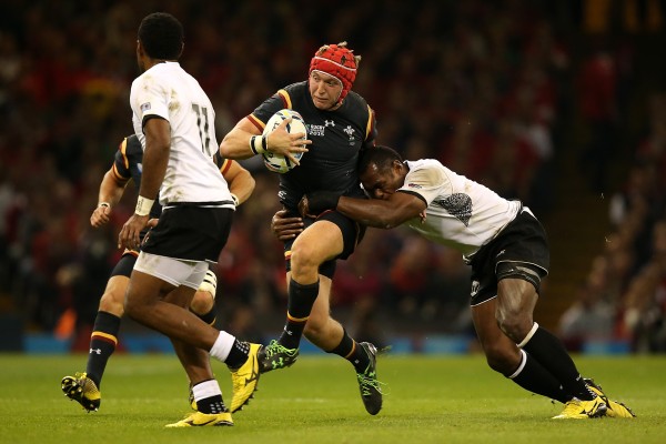 CARDIFF, WALES - OCTOBER 01: Tyler Morgan of Wales is tackled by Vereniki Goneva of Fiji during the 2015 Rugby World Cup Pool A match between Wales and Fiji at Millennium Stadium on October 1, 2015 in Cardiff, United Kingdom. (Photo by Jan Hendrik Kruger/Getty Images)