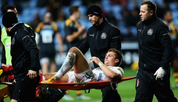 COVENTRY, ENGLAND - DECEMBER 05: Henry Slade of Exeter Chiefs is stretched off during the Aviva Premiership match between Wasps and Exeter Chiefs at the Ricoh Arena on December 4, 2015 in Coventry, England. (Photo by Matthew Lewis/Getty Images)